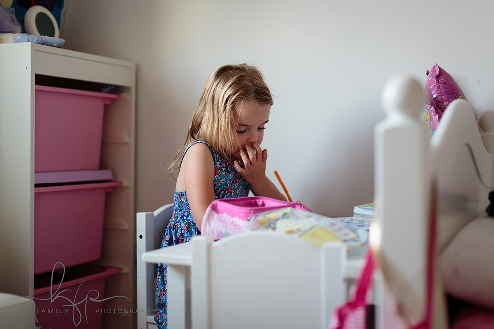 documentary family shoot - Audrey does some colouring in