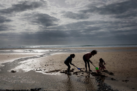 a family photoshoot on St Ouens Bay, Jersey